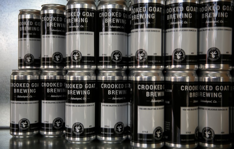 Crowlers behind the bar at Crooked Goat Brewing, in Sebastopol. (Christopher Chung)