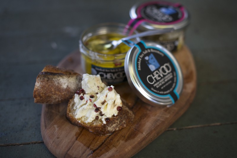 A variety of Chevoo fresh goat cheese & olive oil infusion in Smoked Sea Salt & Rosemary and Aleppo-Urfa Chili & Lemon.