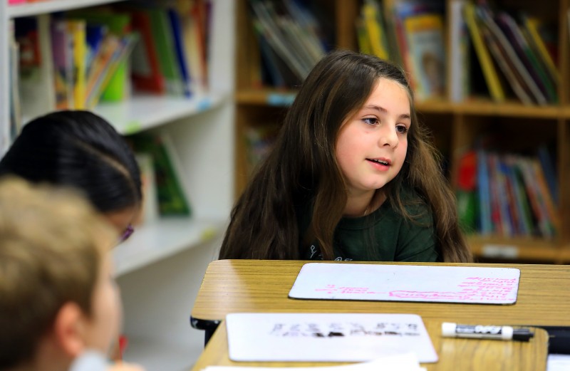 Cali Calmecac Language Academy third grader's in Rosa Villalpando class wrote formal letters to President Donald Trump or outgoing President Barak Obama on inauguration day. Aleena Galvani, 9, said she hopes President Trump will be a good President. (John Burgess)