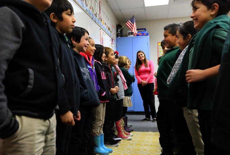 Cali Calmecac Language Academy teacher Rosa Villalpando directs her third grade class in an exercise where you greet the student across from you and ask them questions about their thoughts and goals. (John Burgess