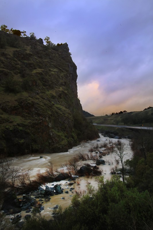 A swollen Russian River flows past Frog Woman Rock along Highway 101 north of Cloverdale, Friday Feb. 3, 2017. (Kent Porter