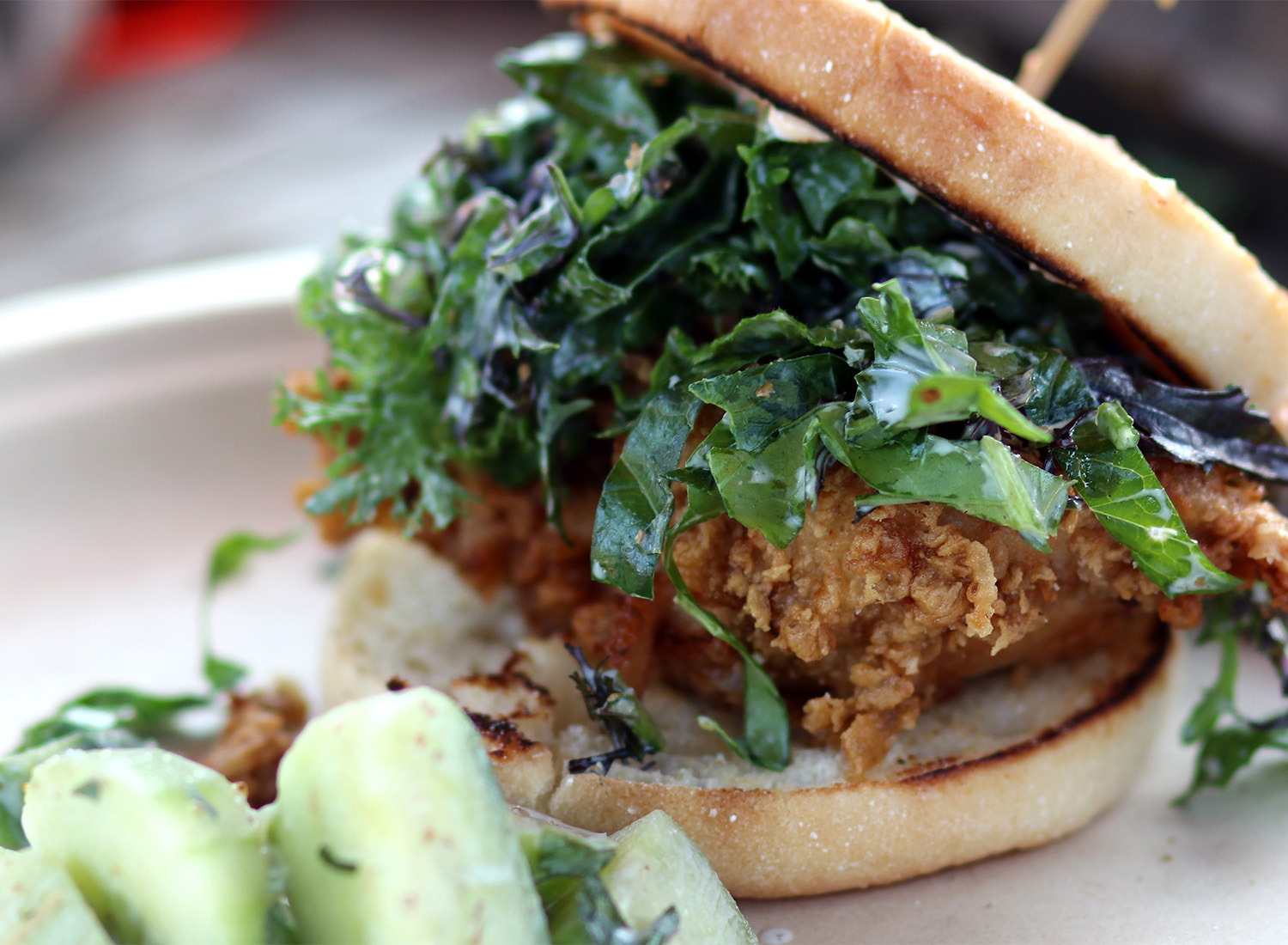 The Bodega, a buttermilk fried chicken sandwich with cucumber salad at The Bodega food truck at The Block in Petaluma. 6/17. Heather Irwin/PD