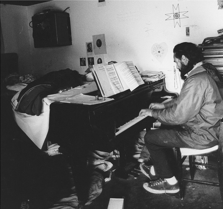 Lou Gottlieb playing Mozart in the egg shed, 1966. (Unidentified photographer. Courtesy of Ramón Sender) 