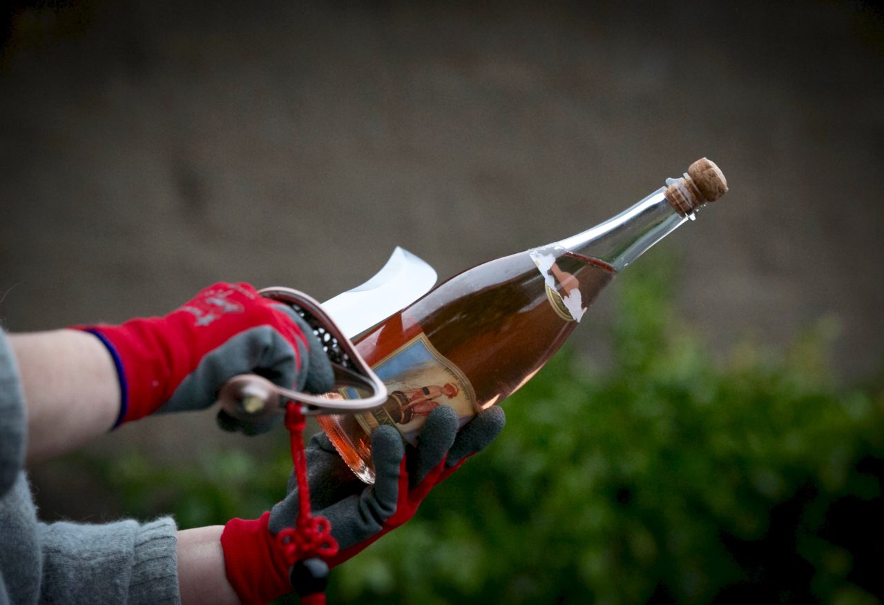 Breathless Wines held its holiday party featuring sabering, the art of lopping off the top of a bottle of bubbly with a sword, in addition to wine and food pairings. (Jeremy Portje)
