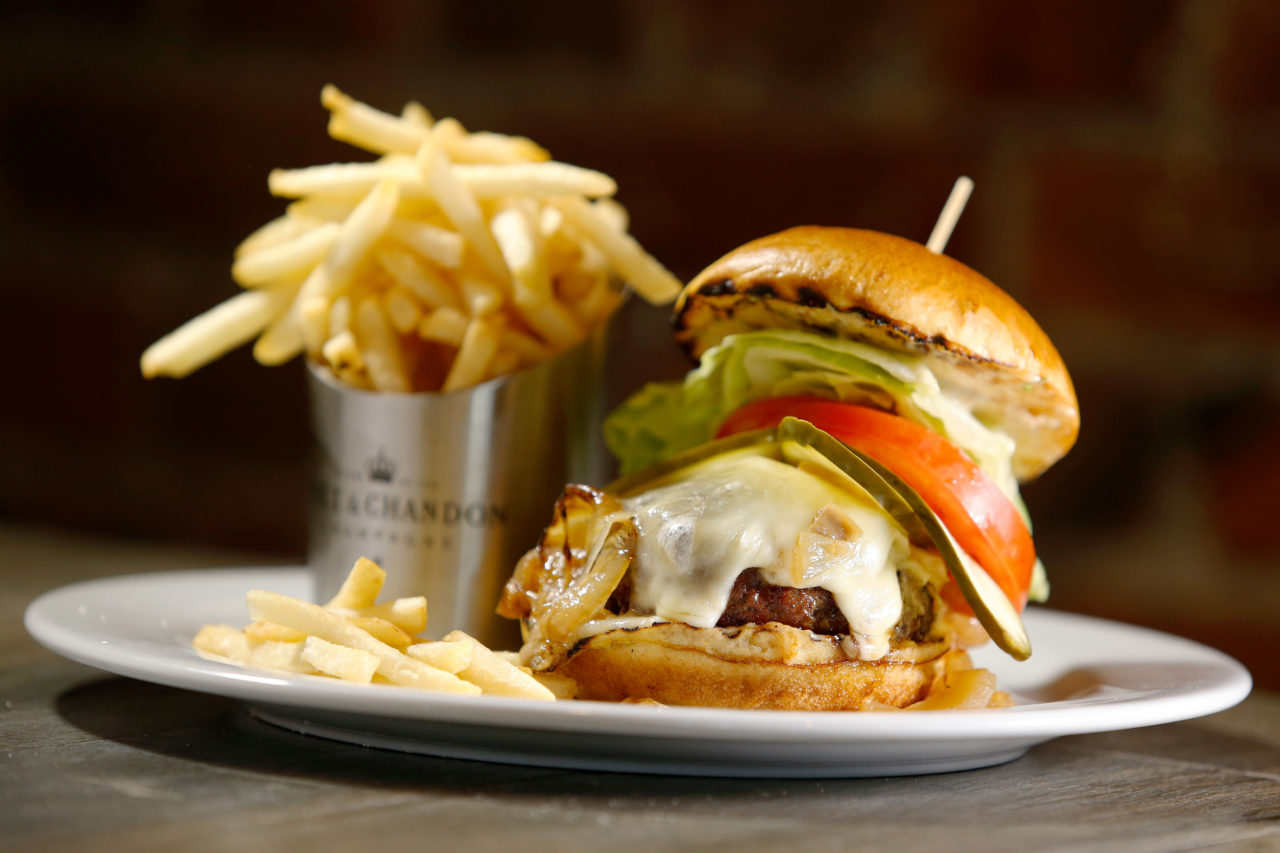 The 256 North burger, Wagyu beef from Snake River Farms, Sierra Nevada white cheddar, grilled Vidalia onions, lettuce, tomatoes on a brioche bun at 256 North in Petaluma, California, on Wednesday, July 19, 2017. (Alvin Jornada / The Press Democrat)