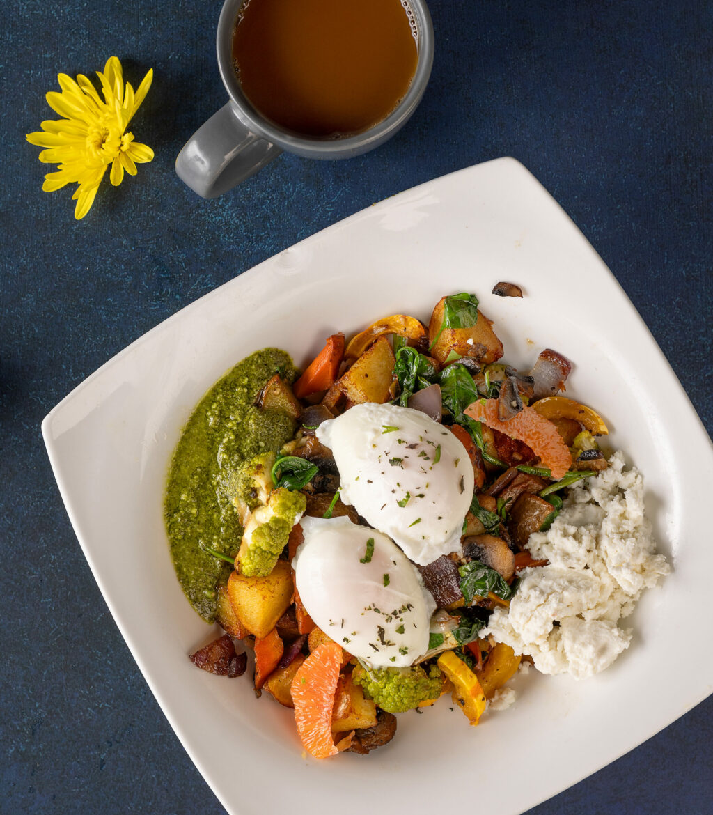 North Bay Vegetable Hash with seasonal vegetables, hash brown, goat cheese, two eggs any style and pesto from J & M’s Midtown Cafe Thursday, January 18, 2024 in Santa Rosa. (Photo by John Burgess/The Press Democrat)