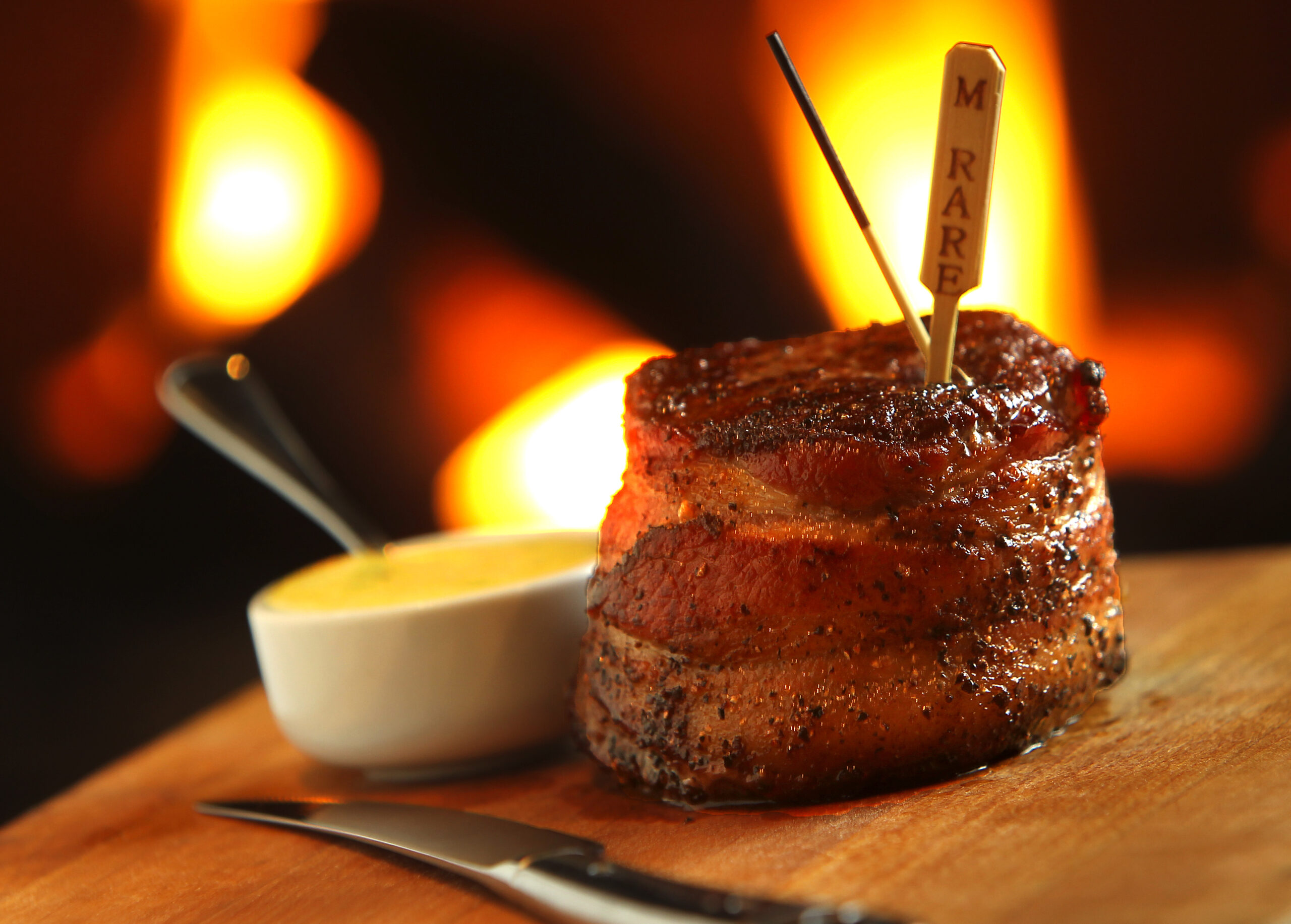 Bacon wrapped 10-ounce filet mignon with the whole grain mustard bearnaise at Stark's Steak & Seafood in Santa Rosa. (John Burgess / The Press Democrat)