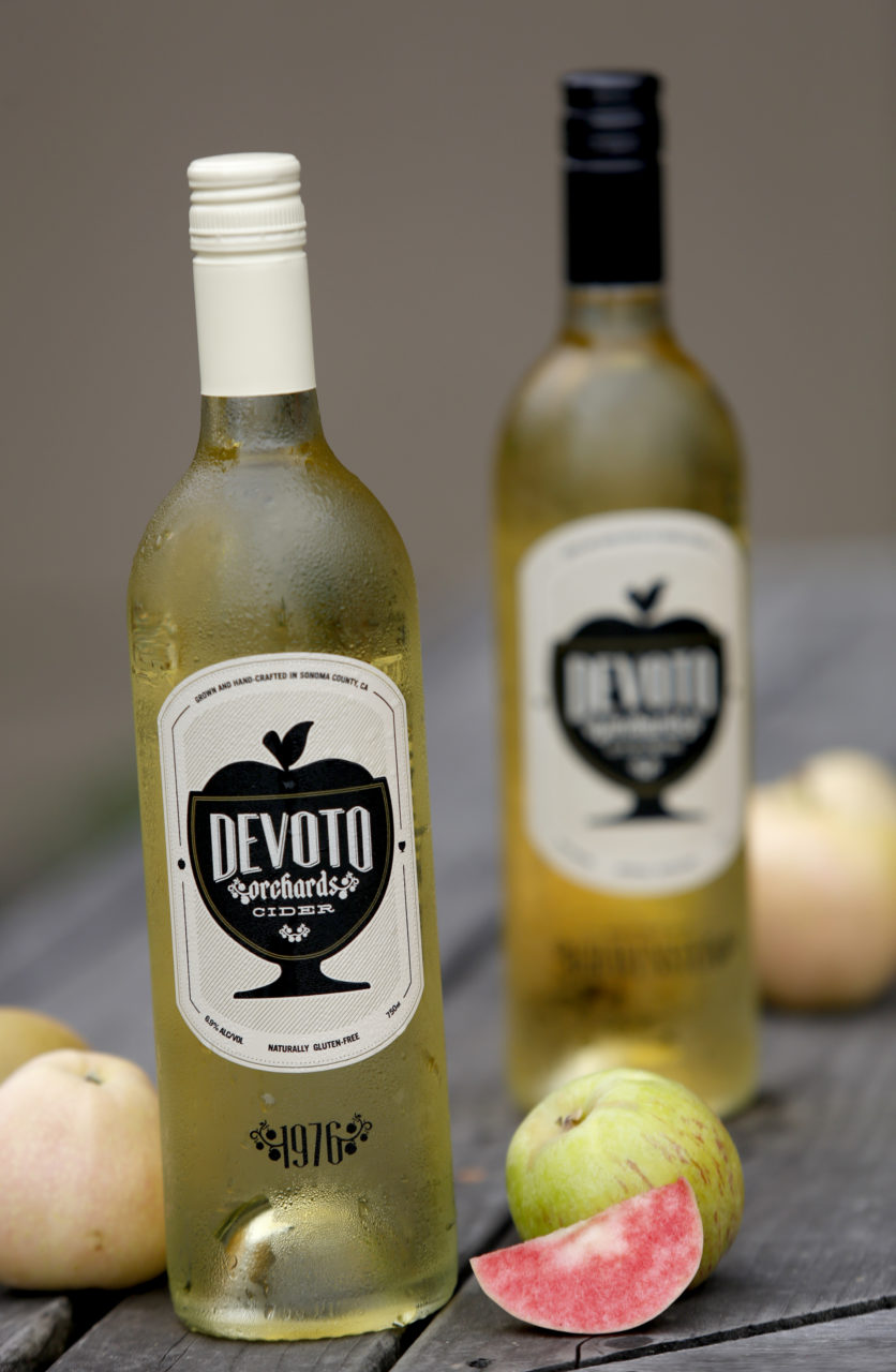 A bottle of 1976, left, and Save the Gravenstein by Devoto Orchard's Estate Cider in Sebastopol, on Tuesday, July 21, 2015 .(BETH SCHLANKER/ The Press Democrat)