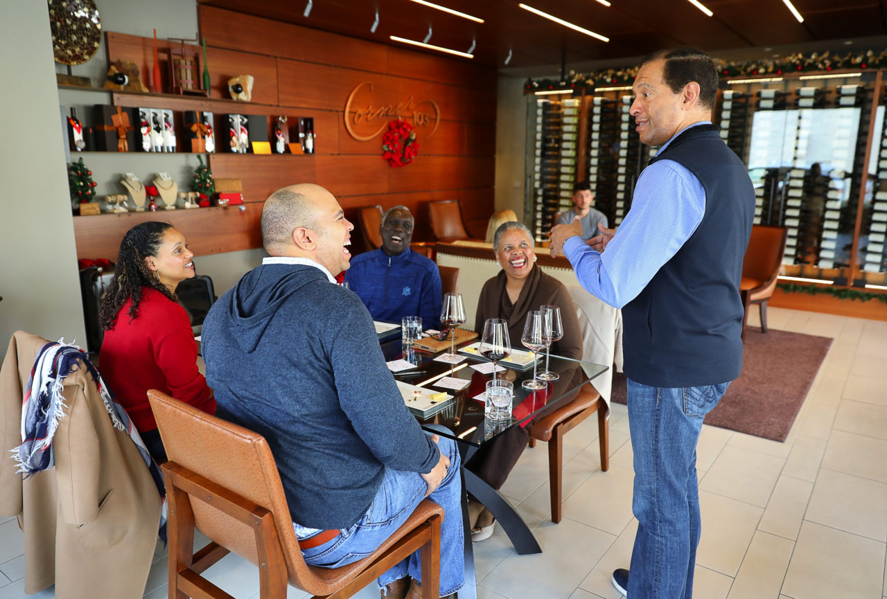 Corner 103 owner Lloyd Davis, right, talks to tasting room visitors Debra Cuthbert, Frank Cuthbert, Joe Fahs, and Jamila Fahs, in Sonoma on Friday, December 15, 2017. (Christopher Chung/ The Press Democrat)