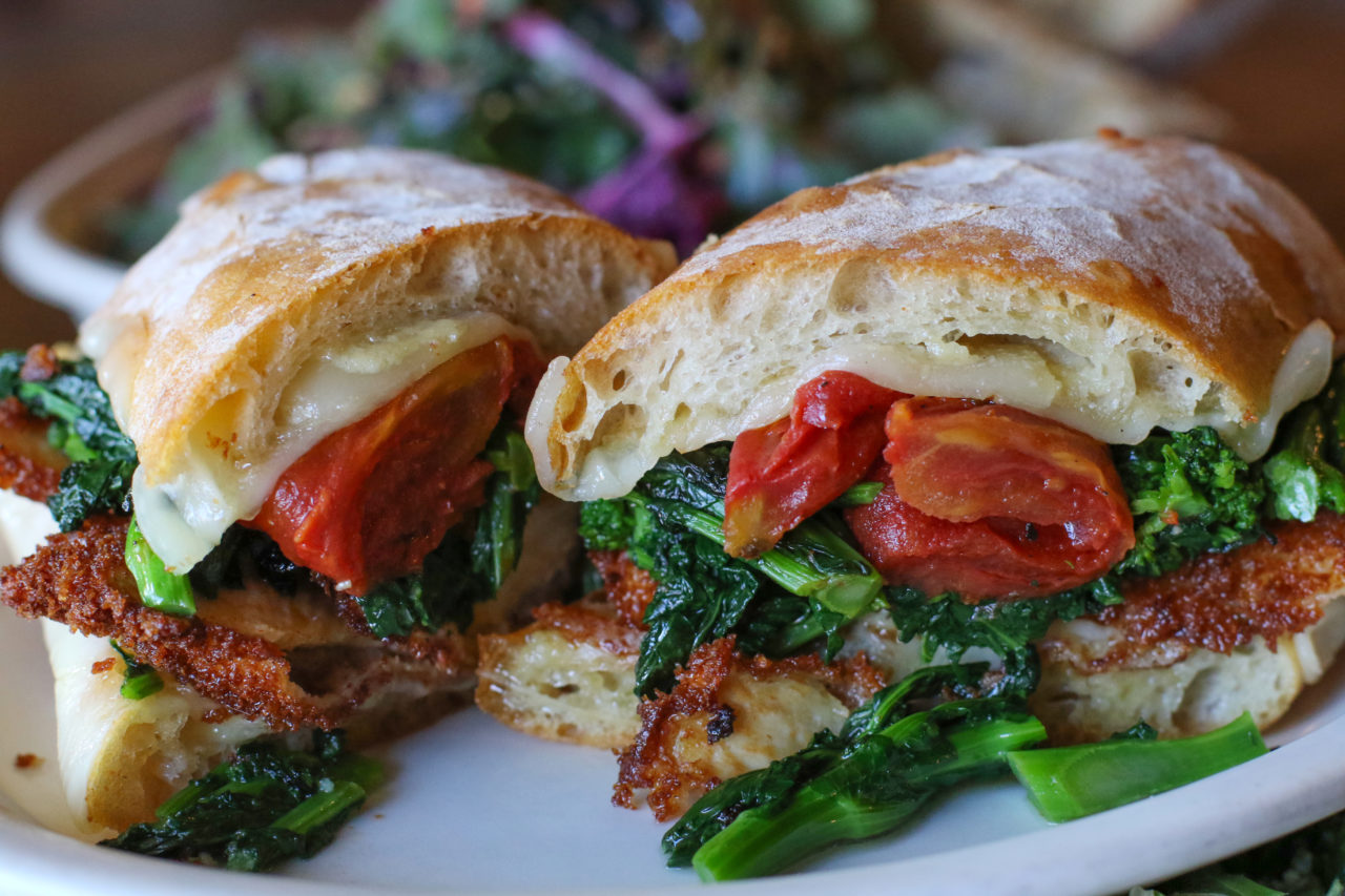 Philly sandwich with fried chicken breast, provolone, oven roasted tomatoes and broccoli rabe from Zoftig Eatery in Santa Rosa. (Heather Irwin/Sonoma Magazine)