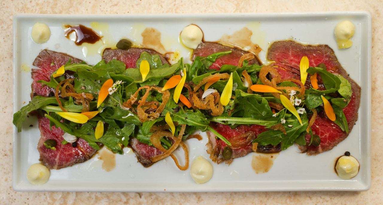 Sonoma Magazine-Eat Here Now. Beef Carpaccio with aged balsamic, extra virgin olive oil, crispy shallots, arugula, capers and aioli from the Perch and Plow on Courthouse Square in Santa Rosa. (photo by John Burgess/The Press Democrat)