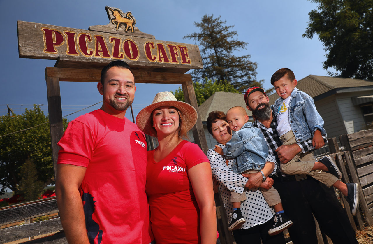Sal Chavez, left, with his wife, Kina Chavez, his parents Kris and Sal Chavez, and his sons Maximus, 2, and Sal, 4, at the Picazo Cafe, in Sonoma. (Christopher Chung/ The Press Democrat)