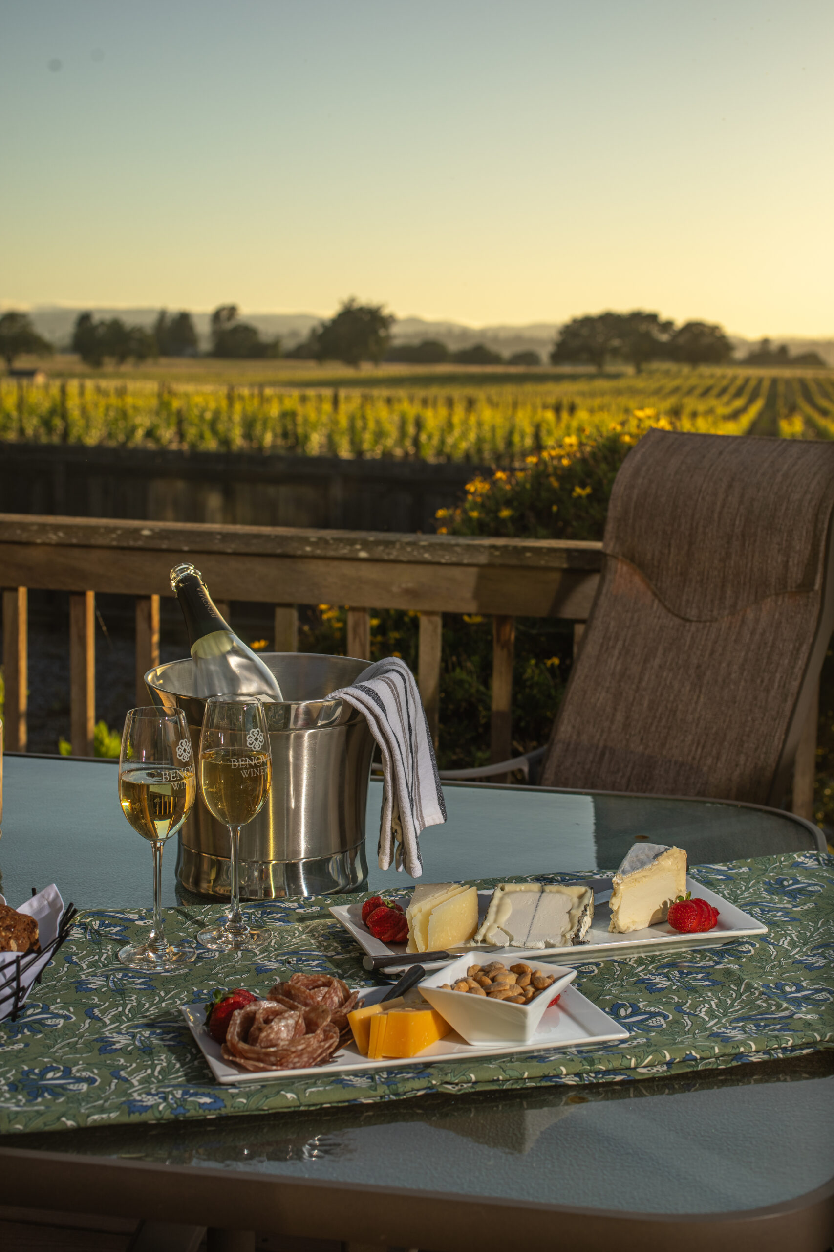 The deck wine wine and charcuterie overlooking vineyards at the Pinot Cottage at Benovia Winery in Santa Rosa.