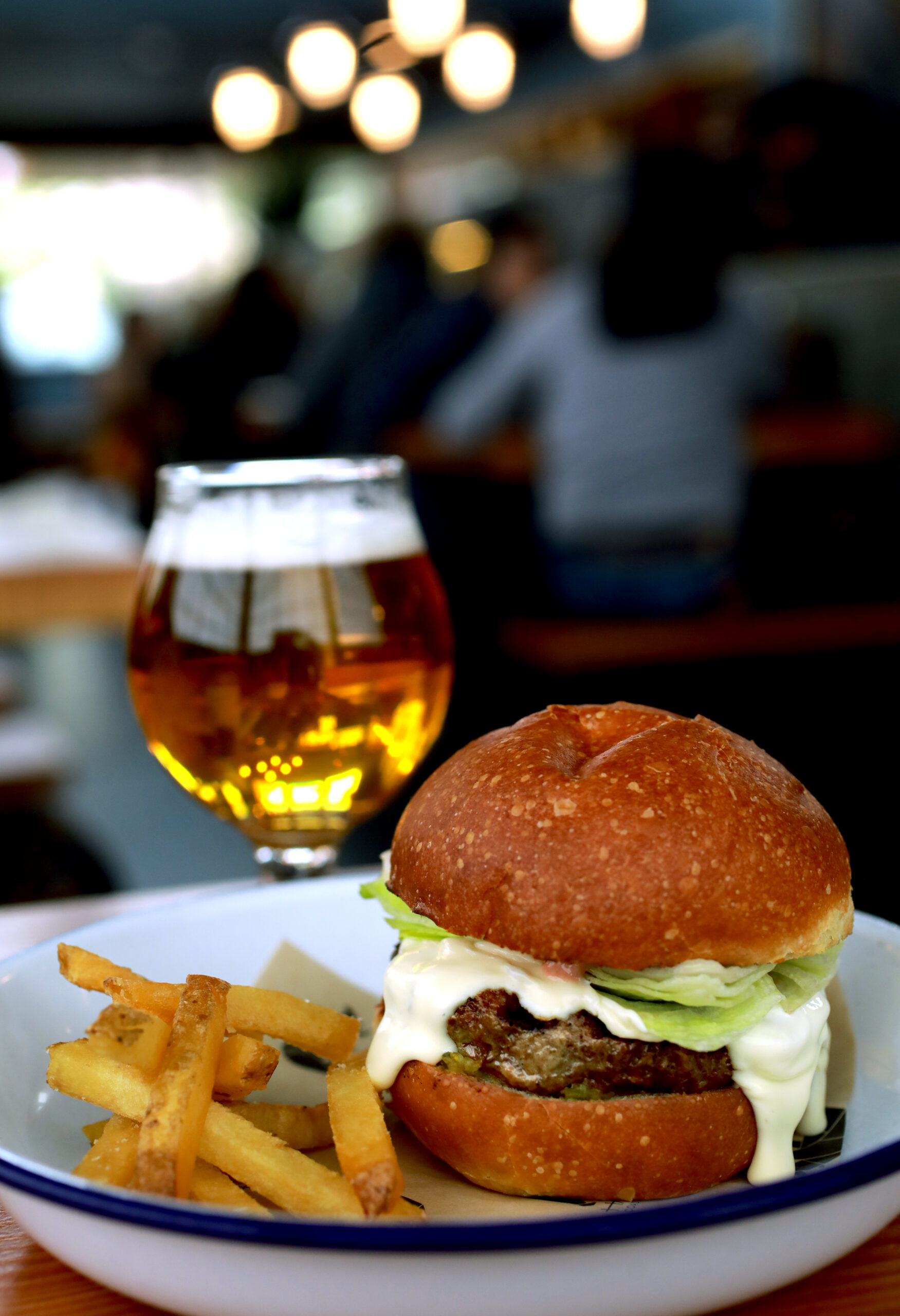 The Handline "Inglewood" burger features pastured beef, St. Jorge fonduta, iceberg lettuce, spicy pickle relish and thousand island on a toasted bun. (John Burgess/The Press Democrat)