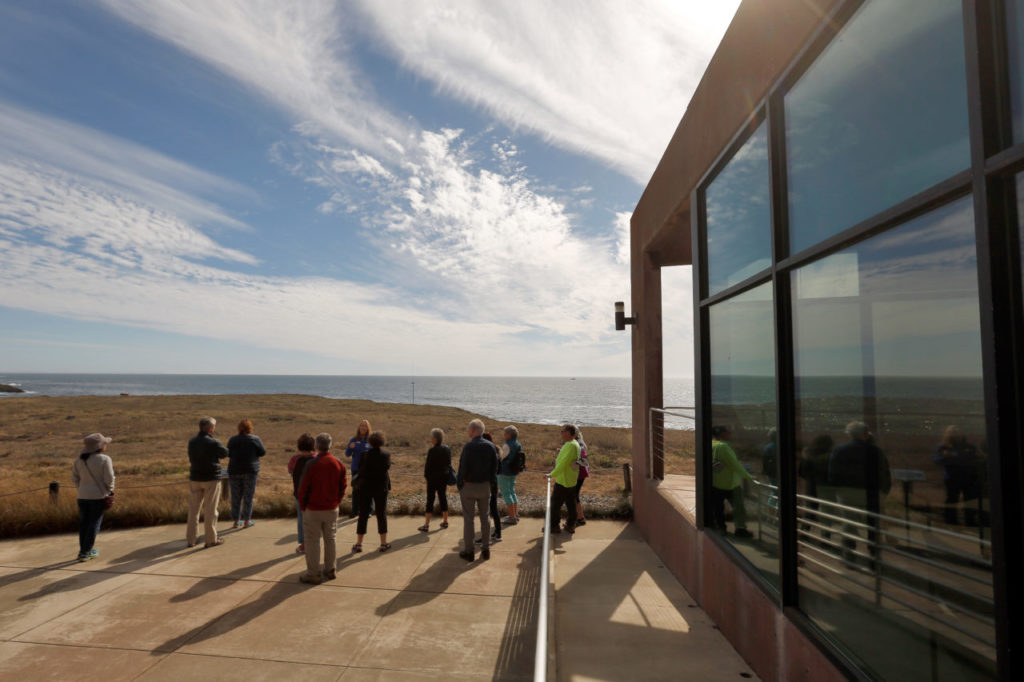 Visitors take in the scenery overlooking the Bodega Marine Reserve during a docent-led tour at UC Davis-Bodega Marine Laboratory, in Bodega Bay, California, on Friday, September 14, 2018. The marine lab is open to the public every Friday from 2:00-4:00 p.m., excluding state and national holidays. (Alvin Jornada / The Press Democrat)