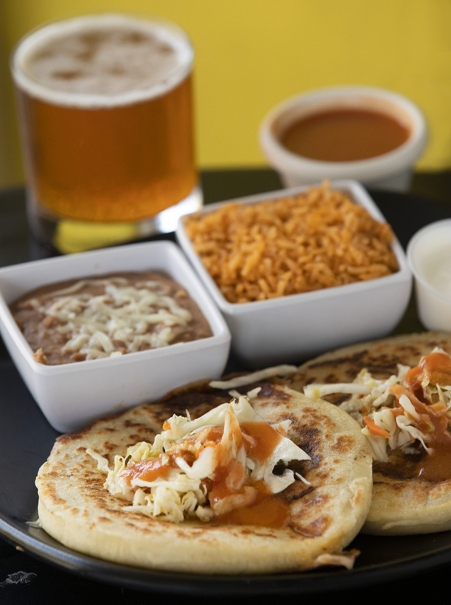 Chicken pupusa combo plate with rice, beans, slaw, crema, and hot sauce from Don Julio's Latin Grill & Pupusas in Rohnert Park on Monday, August 31, 2020. (John Burgess / The Press Democrat)