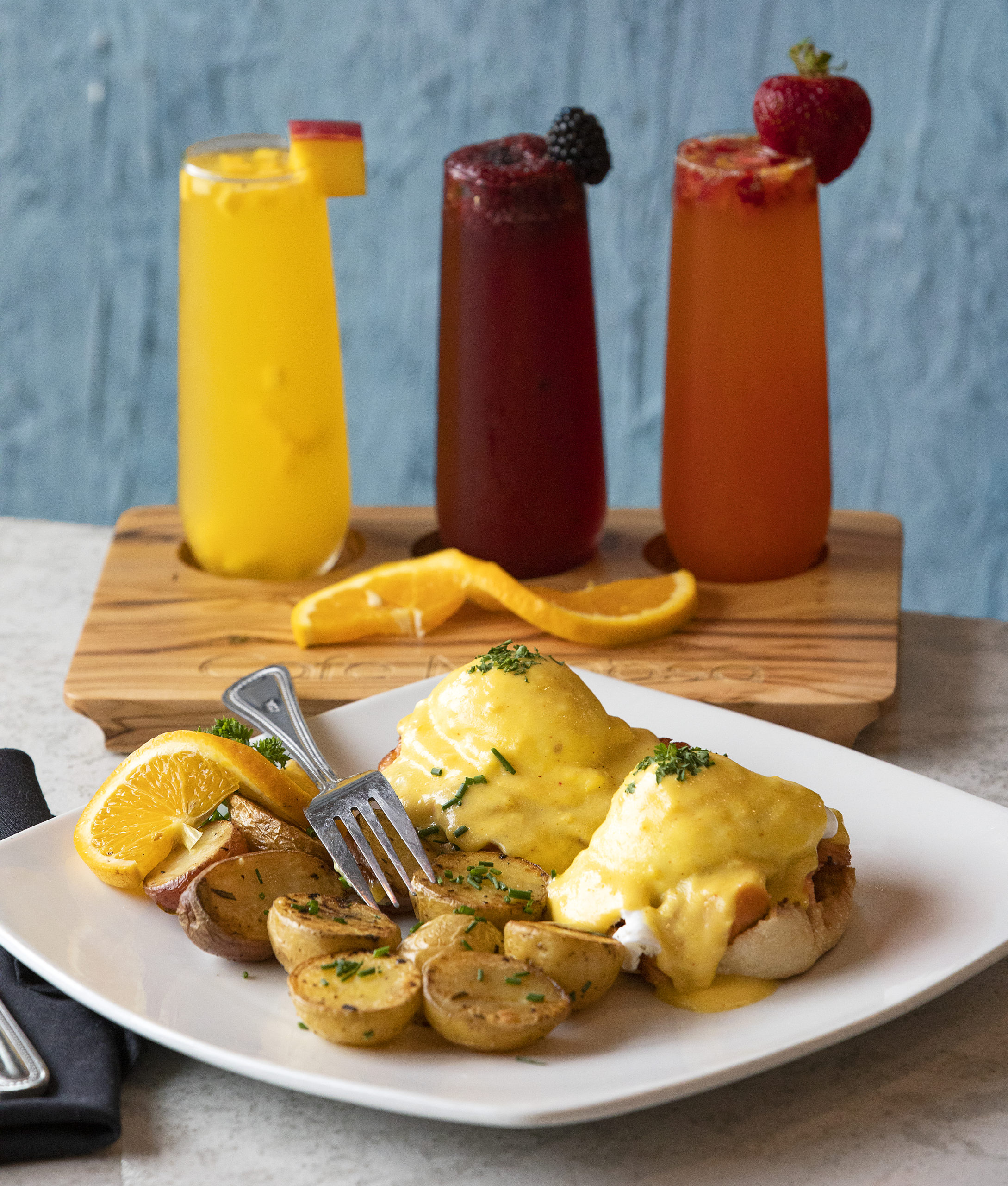 Smoked Salmon Benedict with champagne hollandaise, rosemary house potatoes on an English muffin with a mimosa sampler-from left, mango, blackberry and strawberry-from Cafe Mimosa in Rohnert Park. (photo by John Burgess/The Press Democrat).