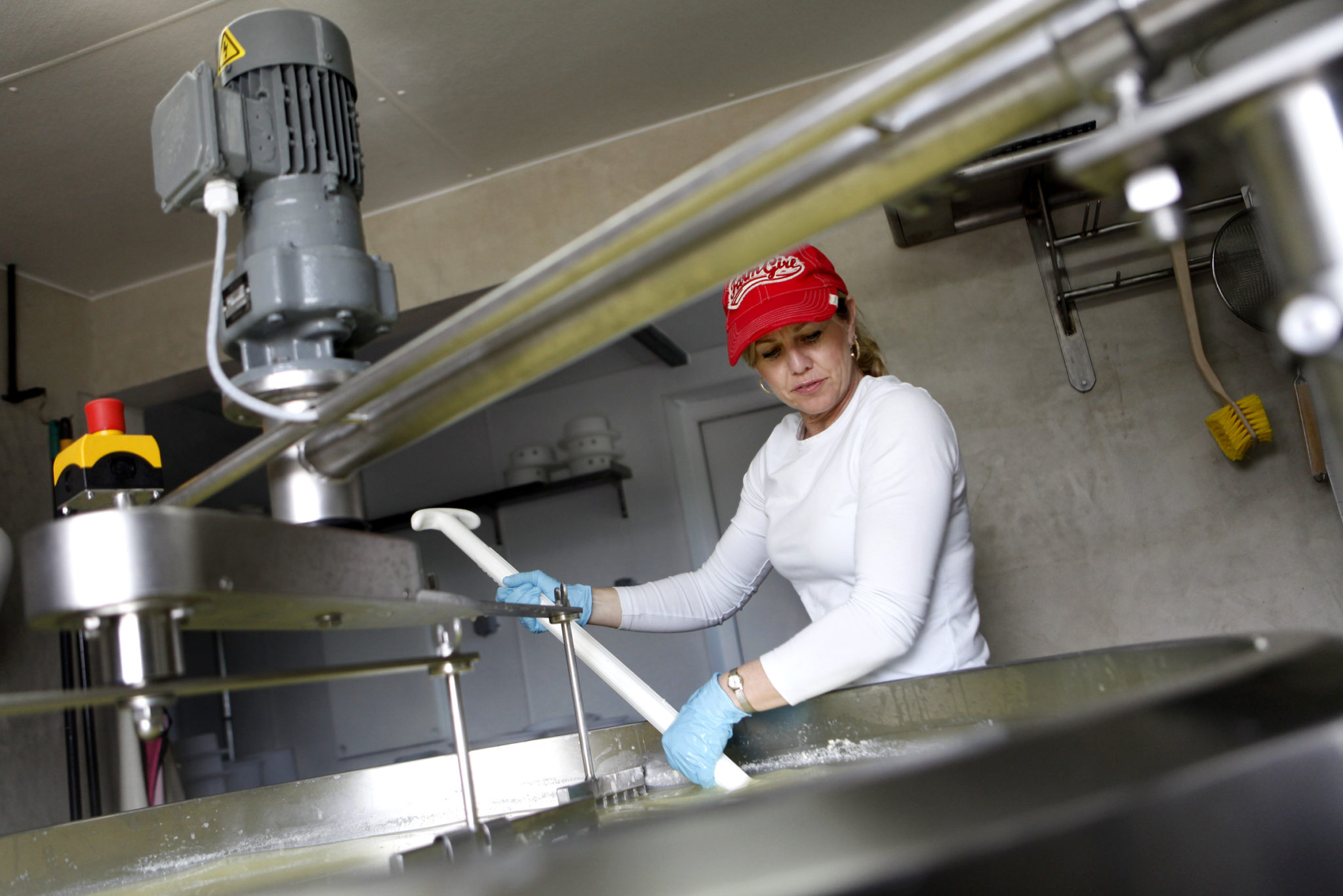 Karen Bianchi-Moreda of Valley Ford Cheese Co. stirs a vat of curds and whey as she makes her Estero Gold cheese at her farm in Valley Ford, California on Thursday, March 3, 2011. (Beth Schlanker/The Press Democrat)