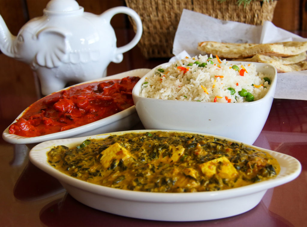 Butter chicken, palak paneer, peas pulav and onion kulcha at Cumin Restaurant in Santa Rosa. Heather Irwin/PD