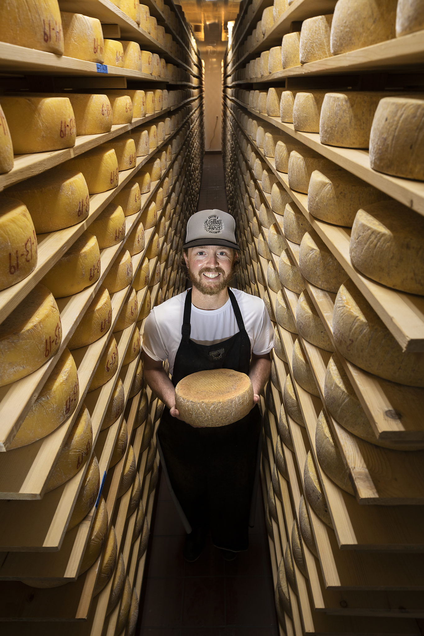 Cheese maker Joe Moreda in the aging room at the Valley Ford Cheese & Creamery. (photo by John Burgess/Sonoma Magazine)