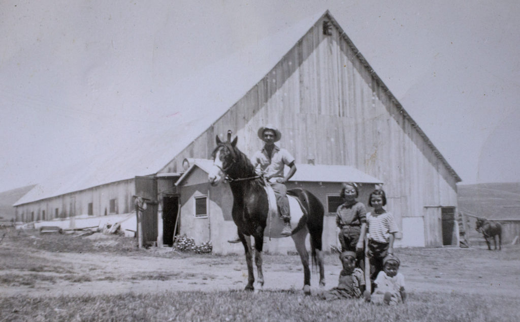 The Bianchi family has owned and operated their 640 acre ranch in Valley Ford since 1918. In this photo from the early sixties Karen Bianchi-Moreda's grandfather John on horseback, grandmother Helen, dad Paul and Uncle George along with a cousin in front of the barn which now holds the cheese making operation. (photo by John Burgess/Sonoma Magazine)