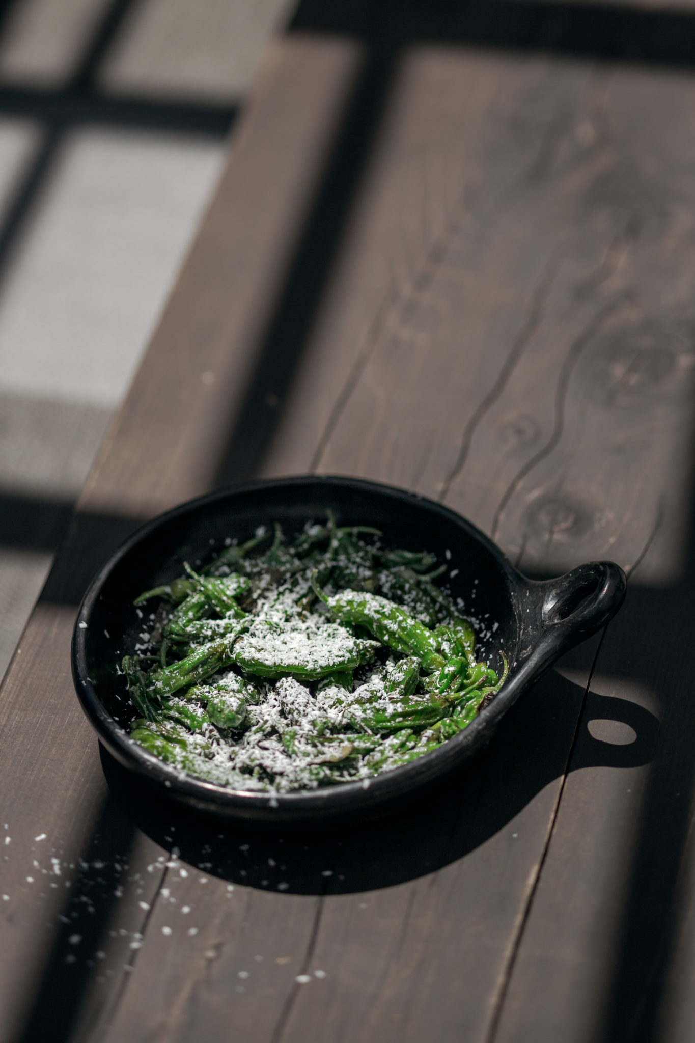 John McReynolds, culinary director of Stone Edge Farm in Sonoma Charred Padron Peppers with Goat Cheese and Sage