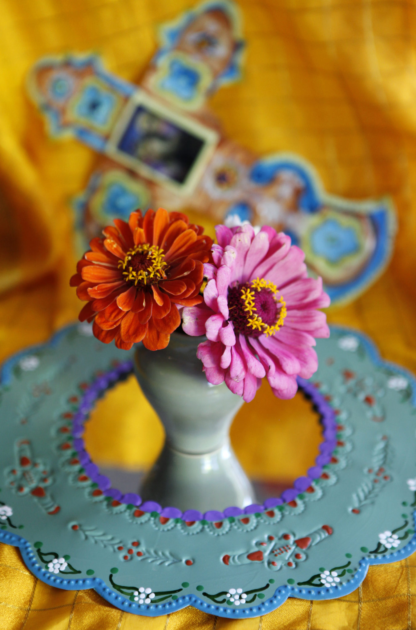 Zinnias and Mexican artwork create a colorful display in the window at Frontburner Open Studio for the D’a de los Muertos or the Day of the Dead celebration in Windsor, California on Sunday, October 9, 2011. (BETH SCHLANKER/ The Press Democrat)