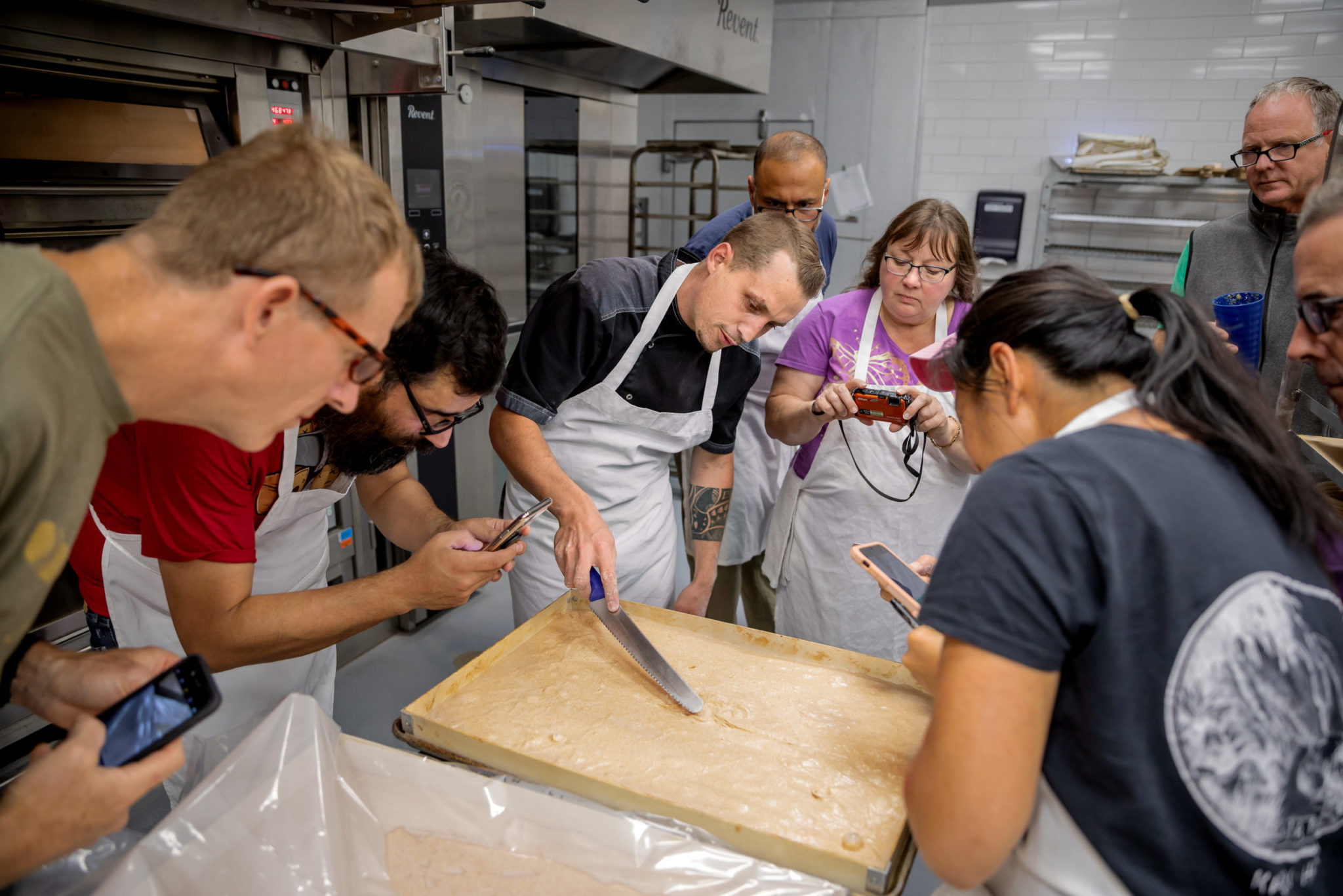 Students use cameras to document instructor Pablo Puluke Giet’s technique at the Artisan Baking Center in Petaluma. (Chris Hardy)