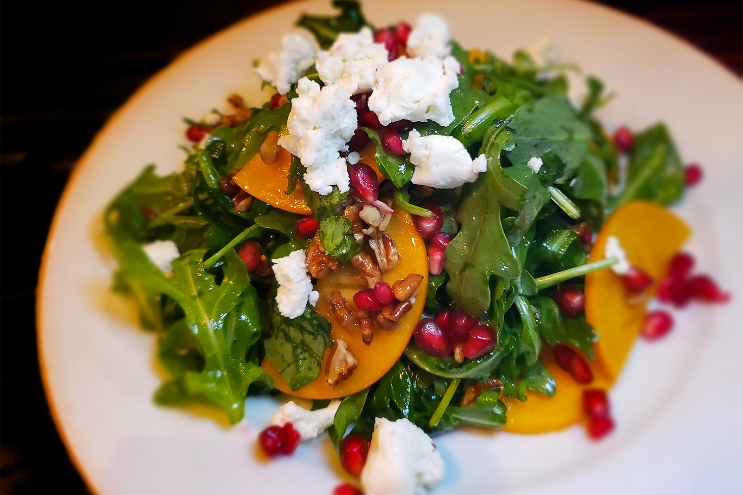 Persimmon and arugula salad at K&L Bistro in Sebastopol. (Heather Irwin / Sonoma Magazine)