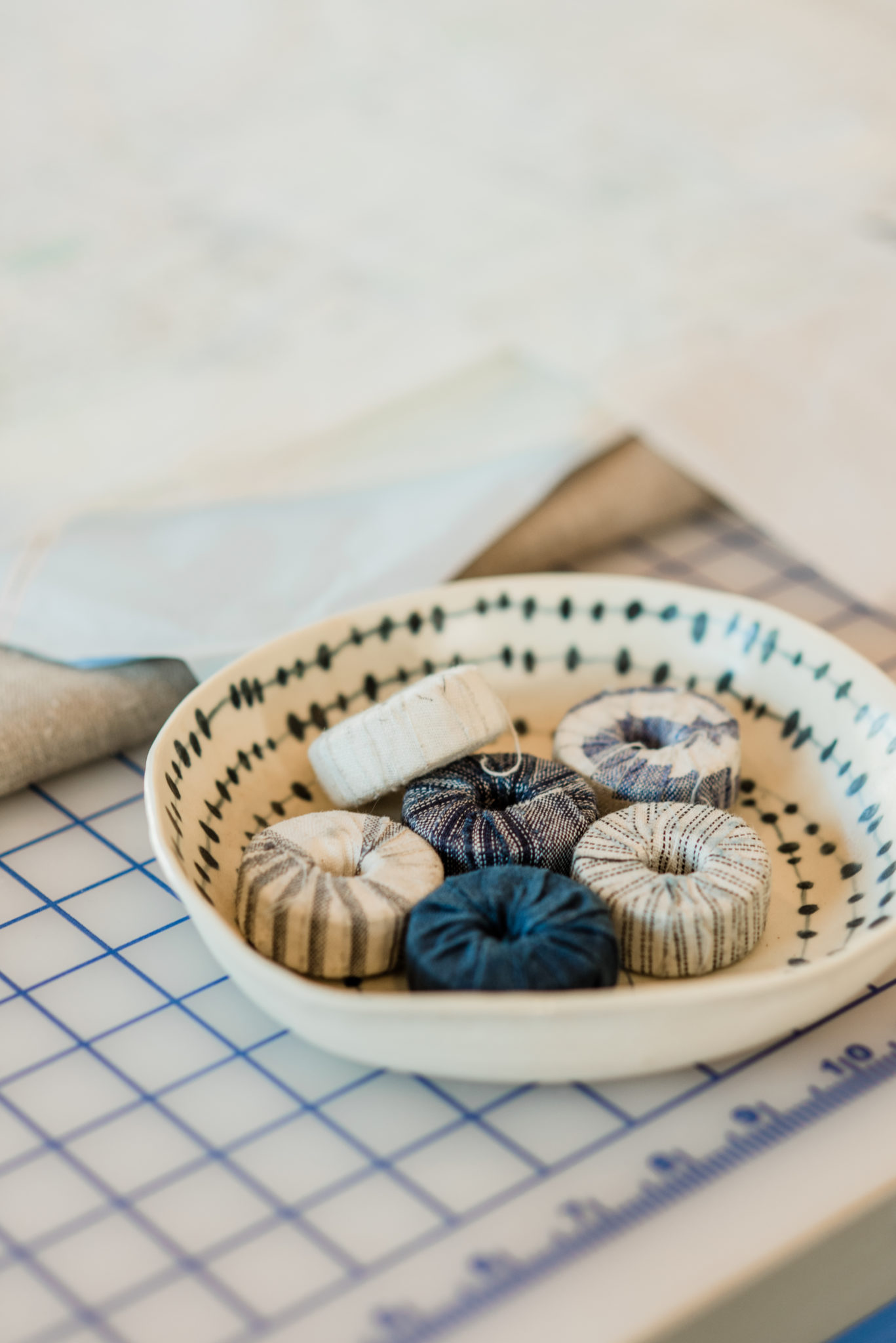 Weights used to hold delicate fabric down while being worked on.