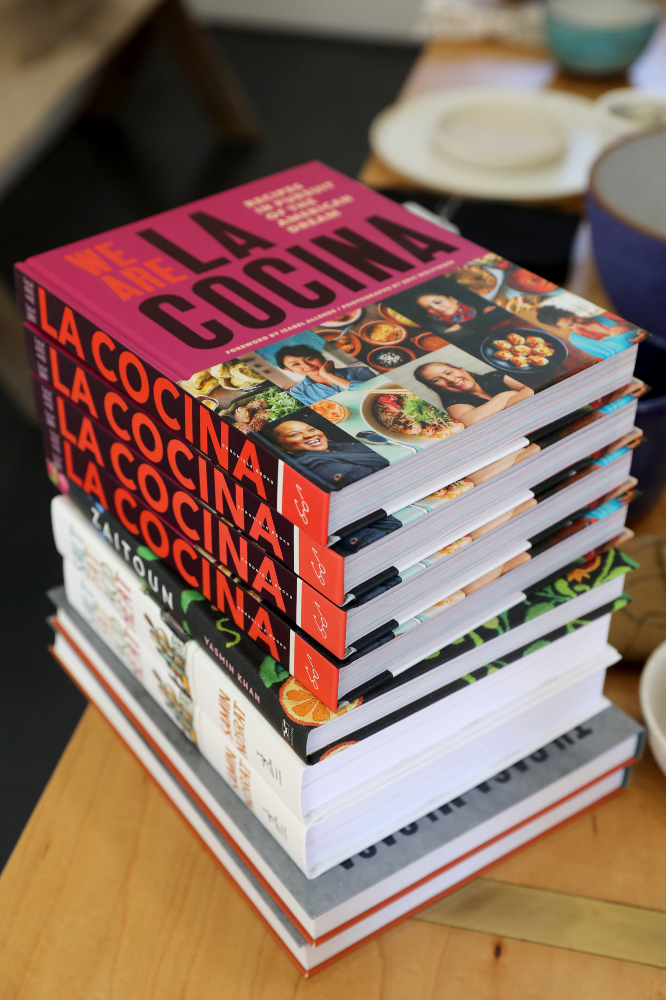 A stack of cookbooks chosen by Sallie Miller and Gwen Gunheim, the owners of Miracle Plum, for their Miracle Plum Cookbook Club. Photo taken in their shop on Davis St. in Santa Rosa on Wednesday, July 10, 2019. (BETH SCHLANKER/ The Press Democrat)