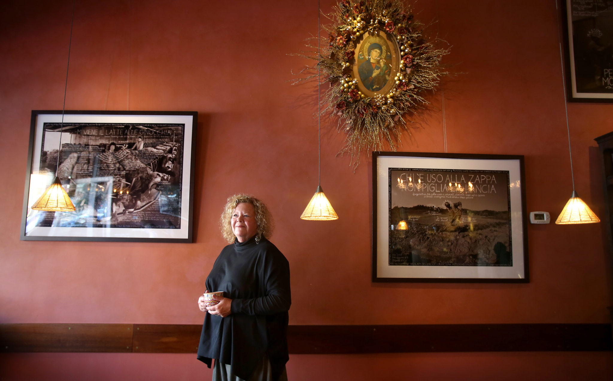 Kathleen Weber, co-owner of Della Fattoria in Petaluma, enjoys the welcoming aspect of the holidays spent with family and friends. (Christopher Chung/ The Press Democrat)