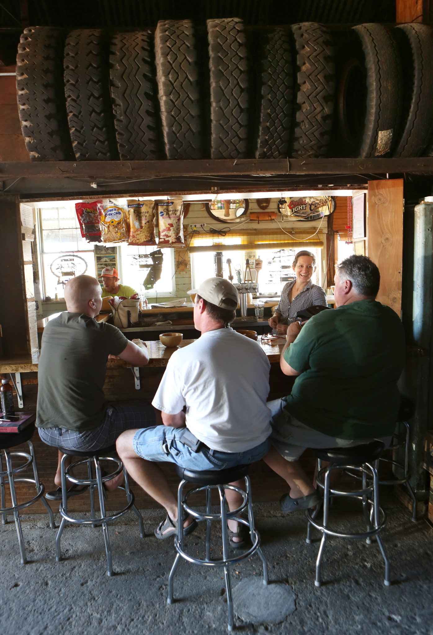 8/3/2013: T1: PC: An overflow crowd sits in garage in the back of Ernie's Tin Bar in Petaluma on Thursday, July 18, 2013. (Conner Jay/The Press Democrat)