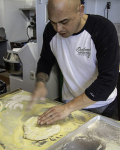 Alastair shows how he works the dough at Acre Pizza in Sebastopol. Heather Irwin/PD