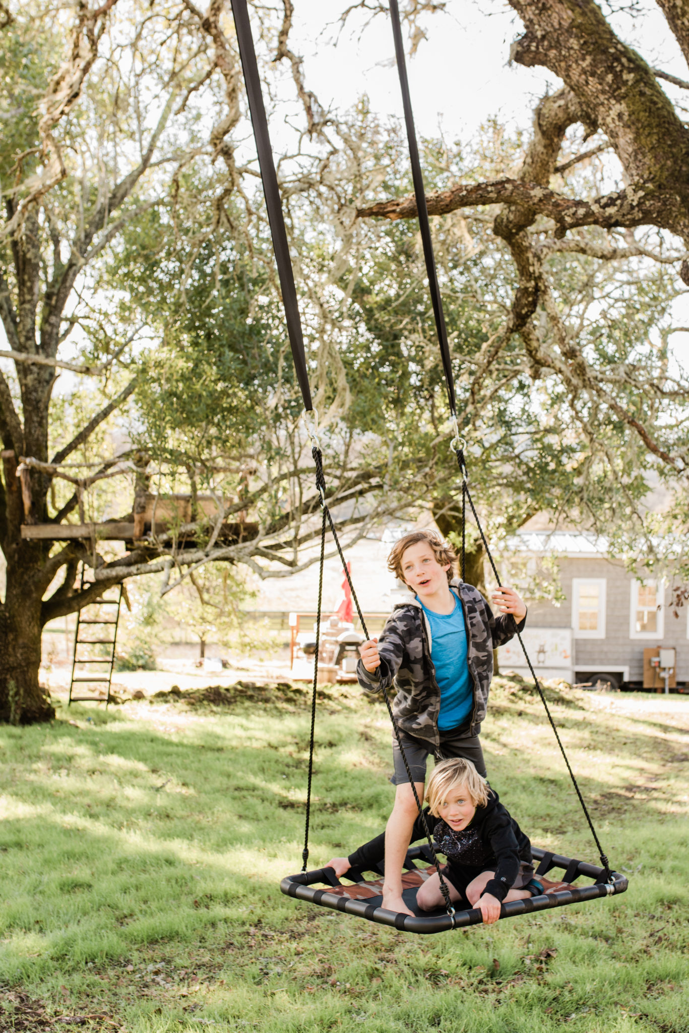 Toby and Kai spend most of their days outside swinging through the trees, playing in their treehouse, biking, and all things outdoors.