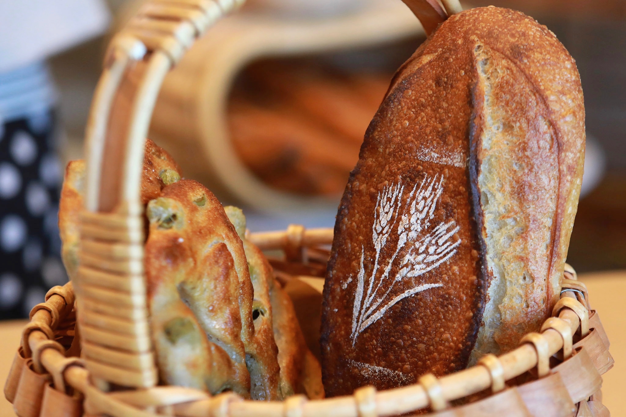 Rye flour and a stencil creates a beautiful pattern on breads at Goguette Bread in Santa Rosa.