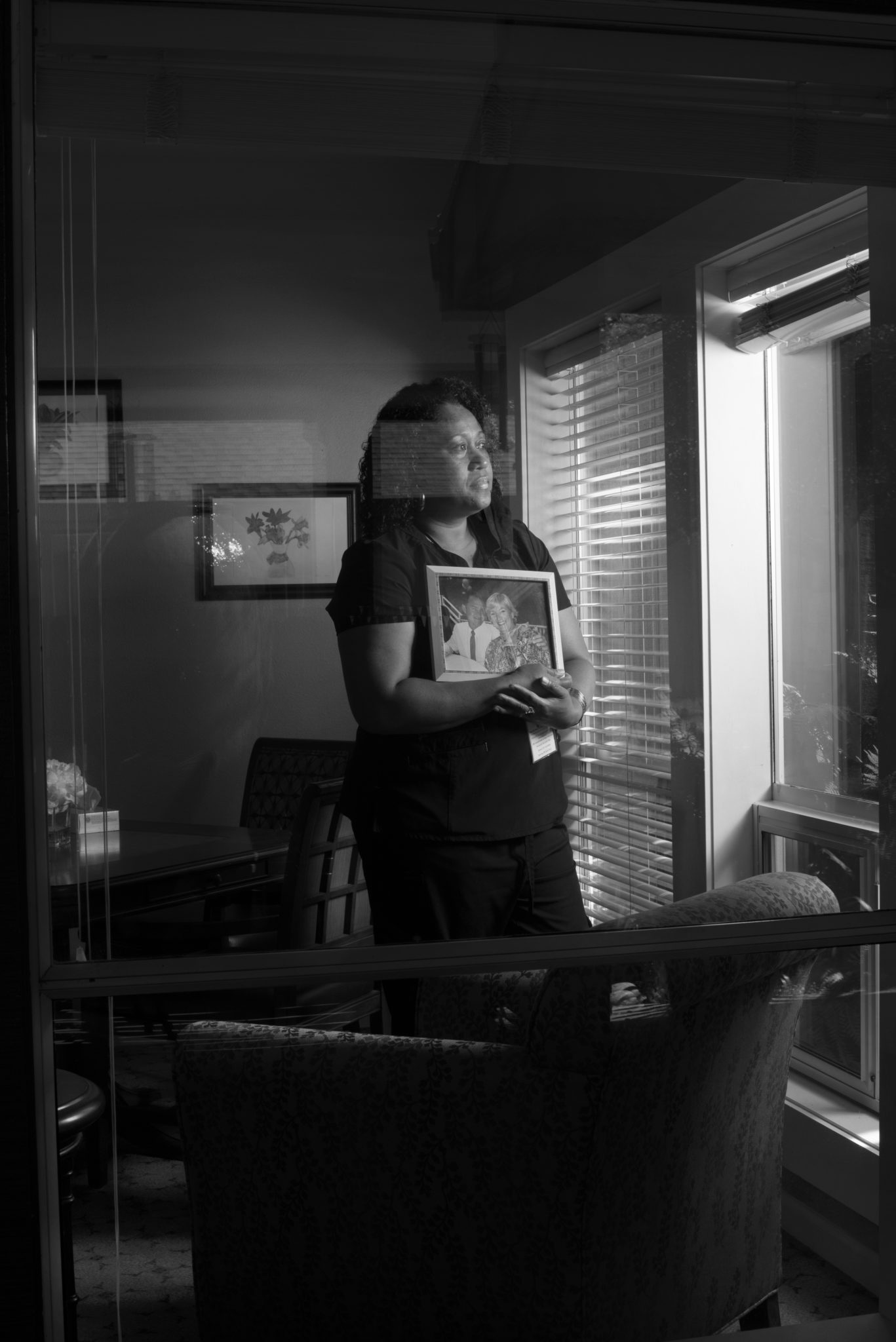 Home caregiver Maraia Maffy, 46, holding an old photograph of a couple who are now in their 80s and are cared for by Maffy at Brookdale Paulin Creek senior assisted living center in Santa Rosa, California on June 6, 2020. (Photo: Erik Castro/for Sonoma Magazine)