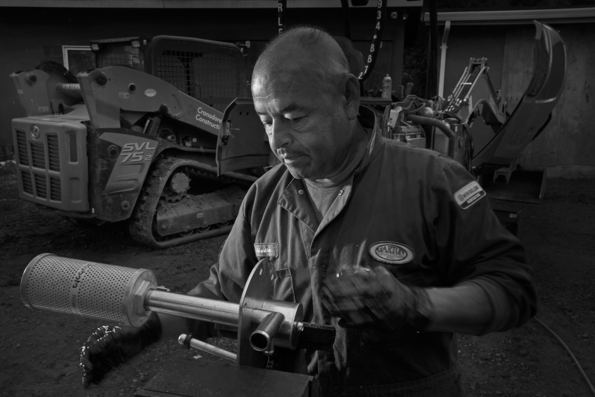 Tractor Repairman Sebastian Juarez, working on a pair of tractors at a home in Sonoma, California on May 14, 2020. (Photo: Erik Castro/for Sonoma Magazine)