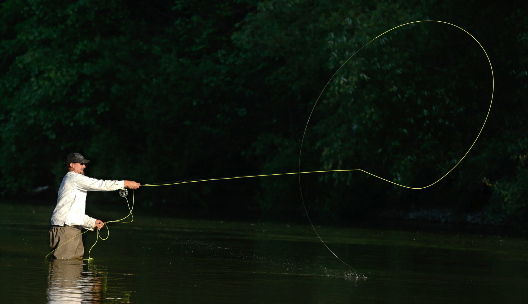 Joe Schriner of Cloverdale casts his line towards the opposite bank while fly fishing in the Russian River. (Alvin Jornada)