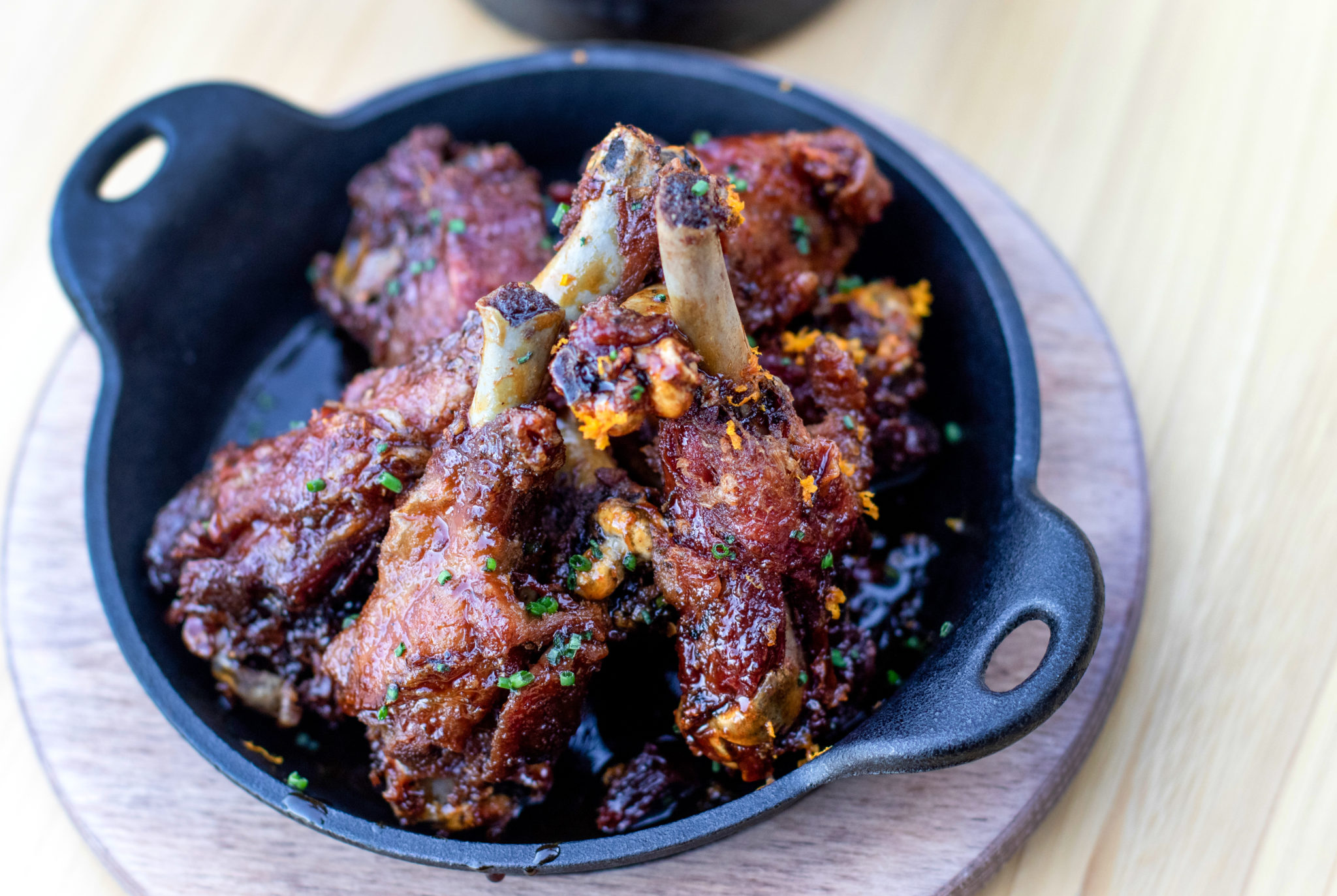 Liberty Farms duck wings with Grand Marnier and black pepper gastrique at Wit & Wisdom in Sonoma. (Heather Irwin / The Press Democrat)
