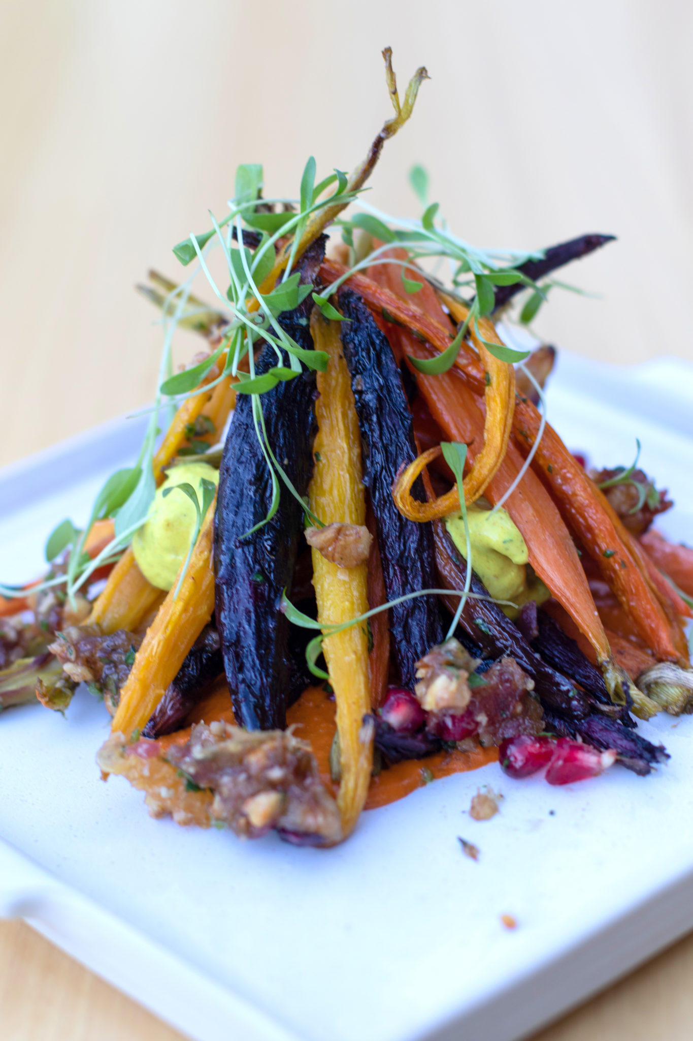 Roasted heirloom carrots with vadouvan yogurt, piquillo pepper, walnuts and tangerine vinaigrette at Wit & Wisdom in Sonoma. (Heather Irwin / The Press Democrat)