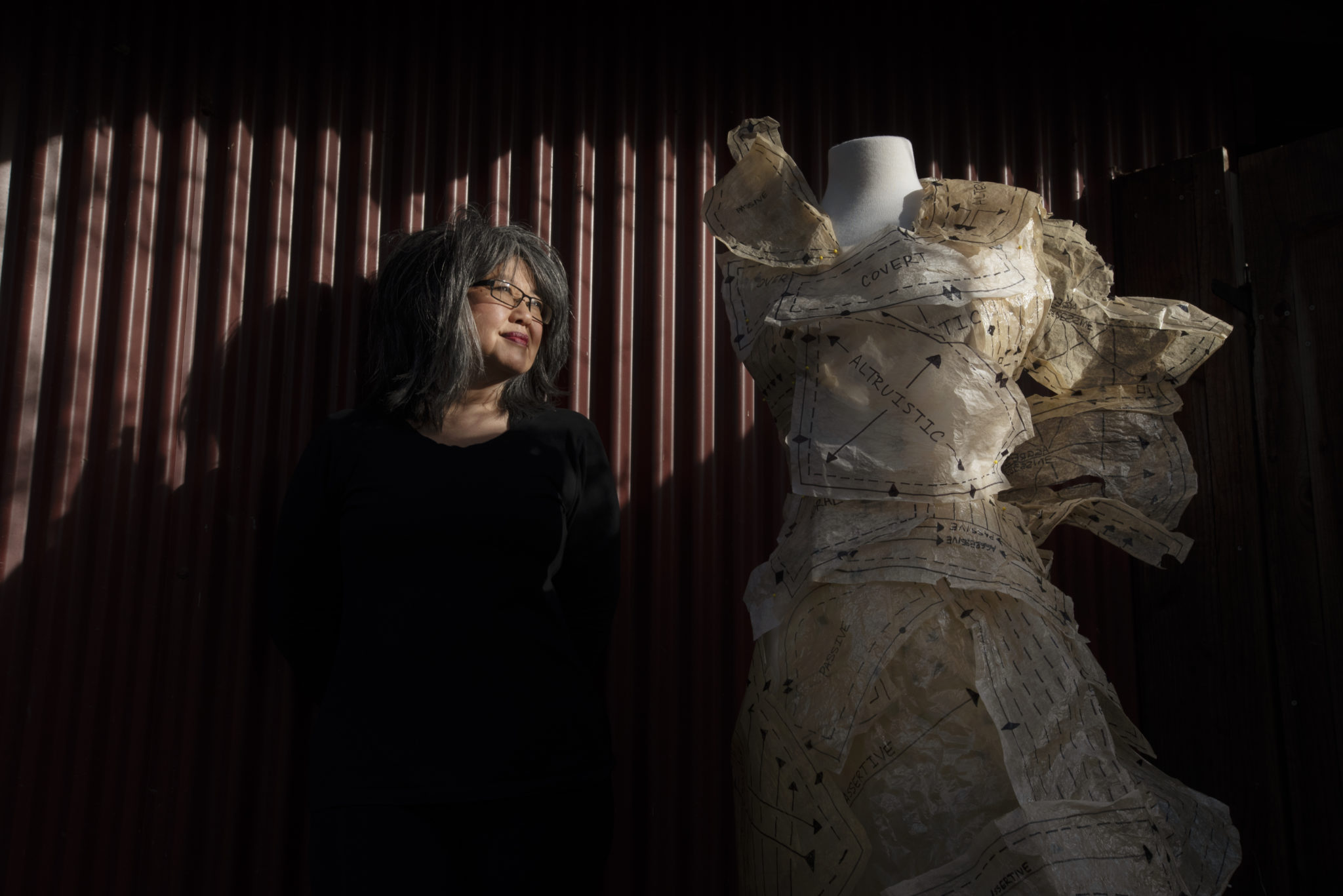 Artist C.J. Itamura with a dress titled, ÒBehaviorÓ that she made out of paper found in shoeboxes at her home studio in Santa Rosa, California. January 15, 2021. (Photo: Erik Castro/for Sonoma Magazine)