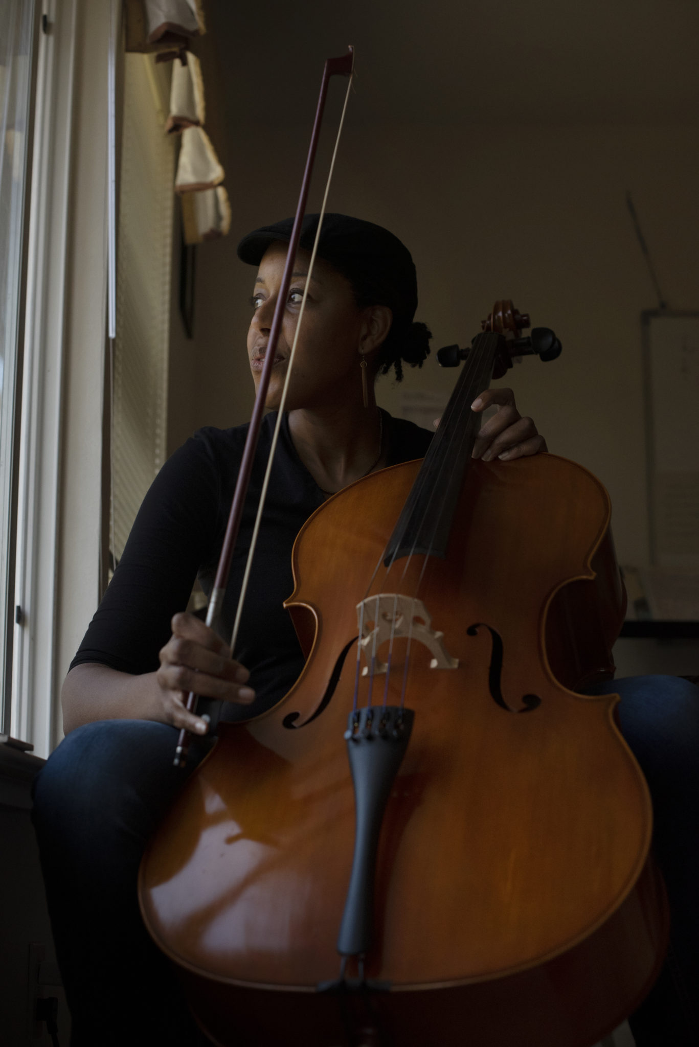 Singer-Songwriter Eki Shola at her home studio with her cello that she uses on some tracks for her songs in Santa Rosa, California. January 11, 2021. Shola started playing cello in middle school but says she is more comfortable with her skills on the piano. (Photo: Erik Castro/for Sonoma Magazine)