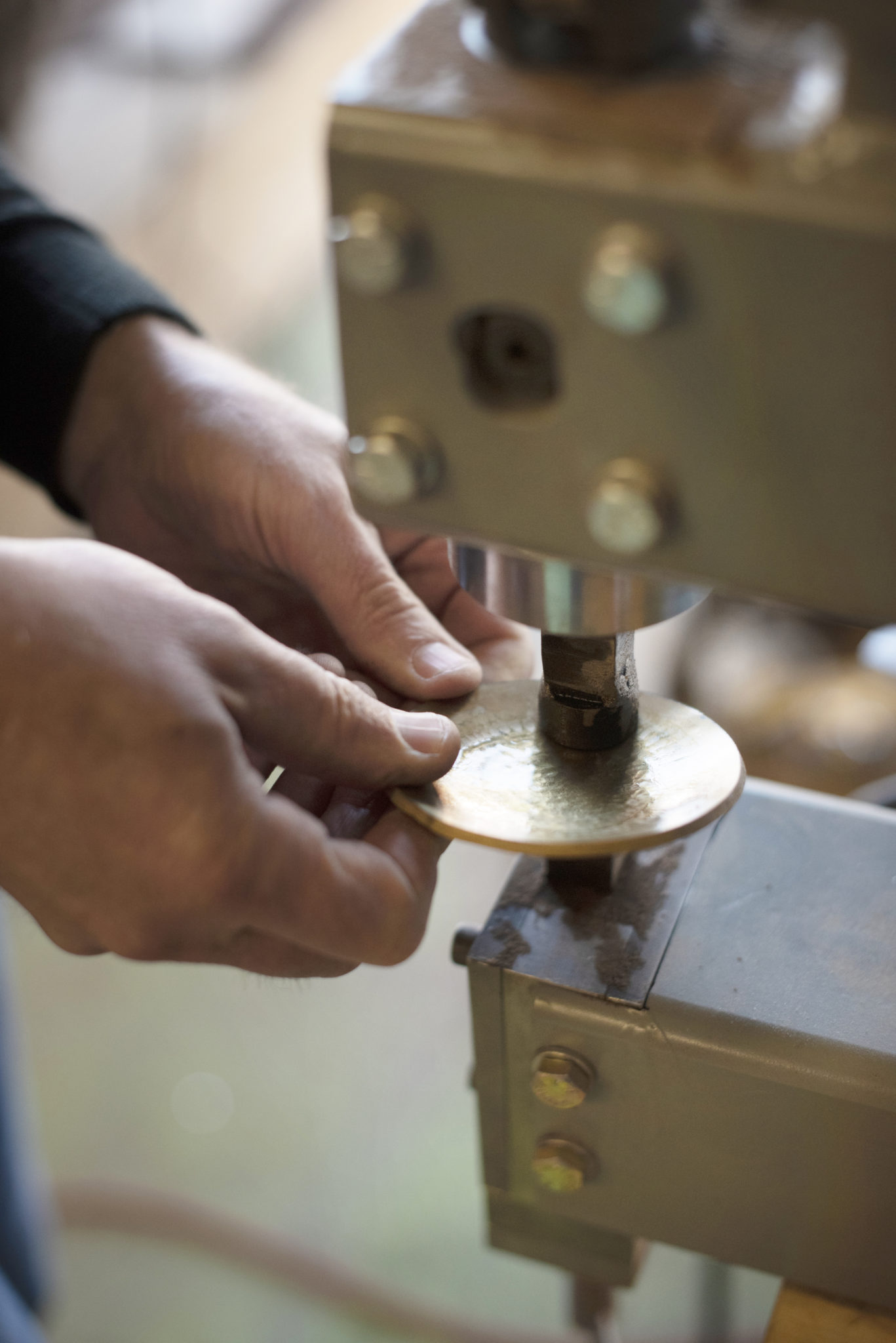 Furniture maker Paul Benson shaping a piece of naval brass on a machine called a power hammer that his octogenarian father made for Benson at his workshop in Sonoma, California. January 14, 2021. (Photo: Erik Castro/for Sonoma Magazine)