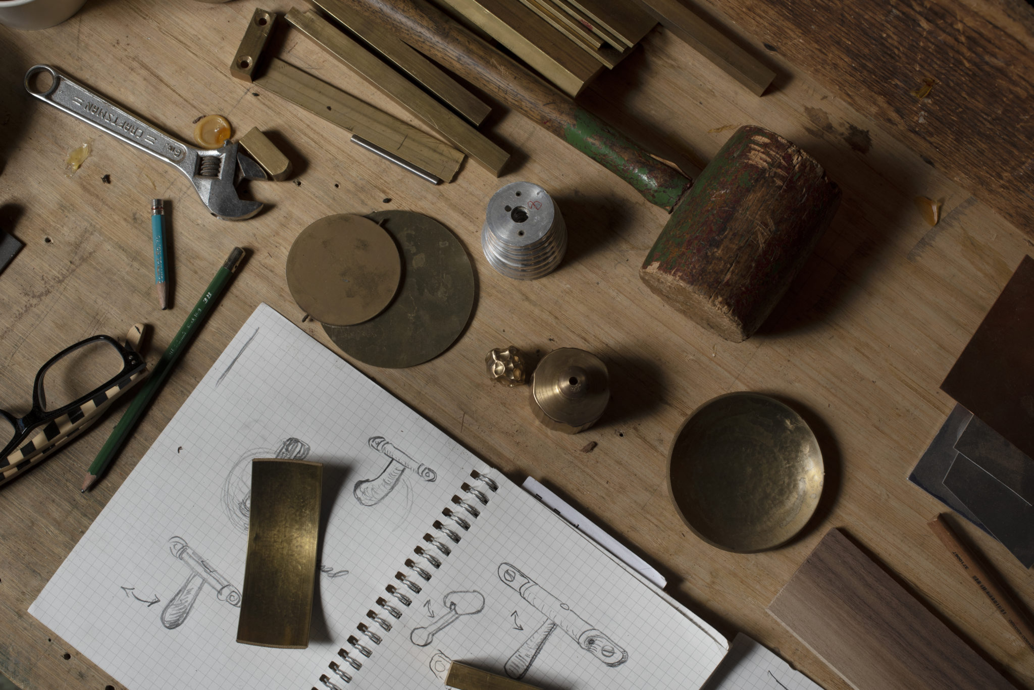 Furniture maker Paul Benson with hand-drawn ideas for handles for a piece of furniture along with a variety of tools at his workshop in Sonoma, California. January 14, 2021. (Photo: Erik Castro/for Sonoma Magazine)