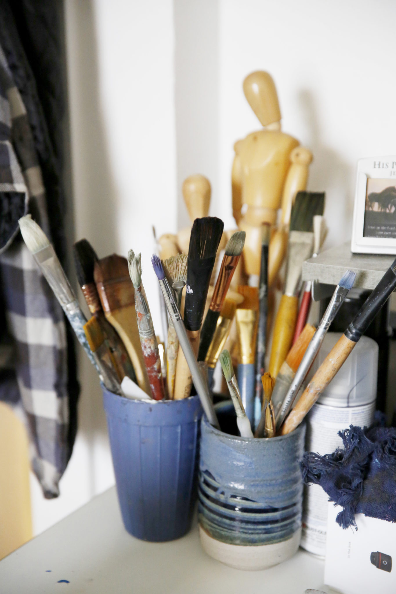 A variety of brushes inside artist Orin Carpenter's art studio in Novato, Calif., on Sunday, March 14, 2021. (Beth Schlanker/ The Press Democrat)