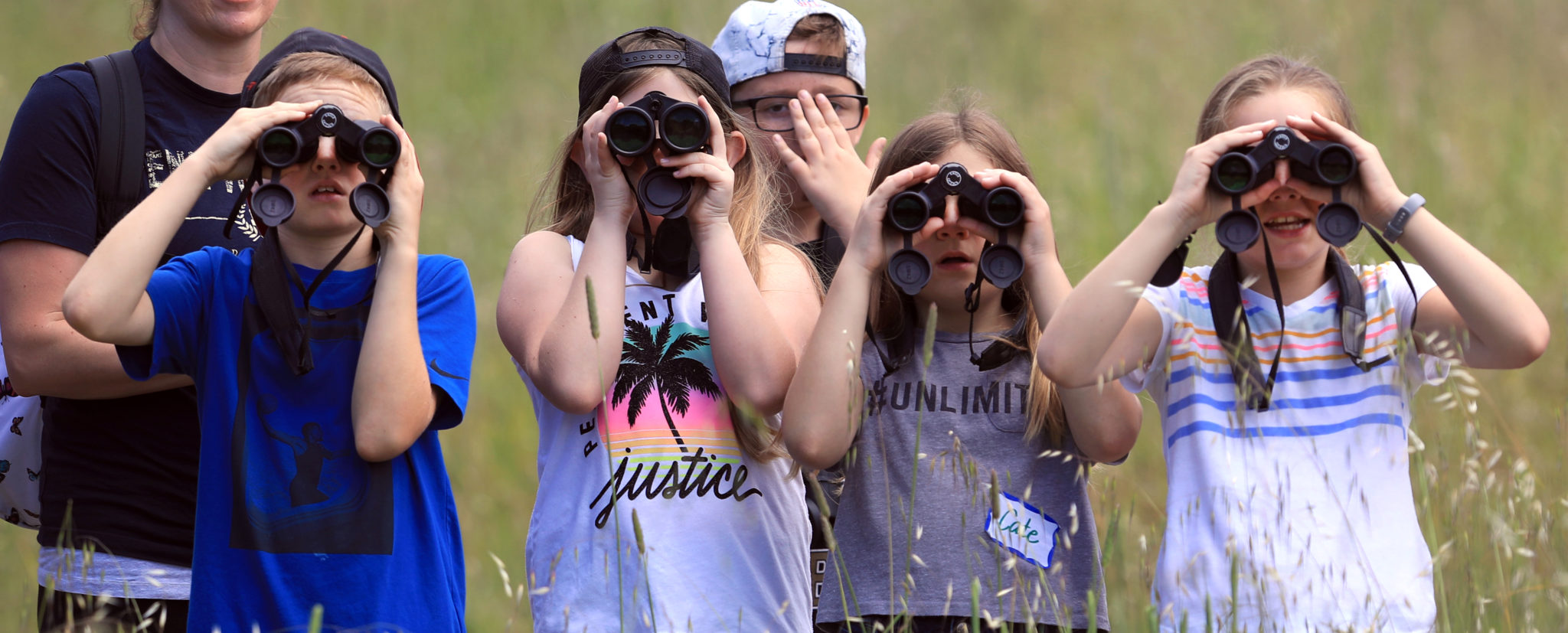 Students with Strawberry Elementary School in Santa Rosa use binoculars to view the open spaces of Pepperwood Preserve, Thursday, May 23, 2019. (Kent Porter / Press Democrat) 2019