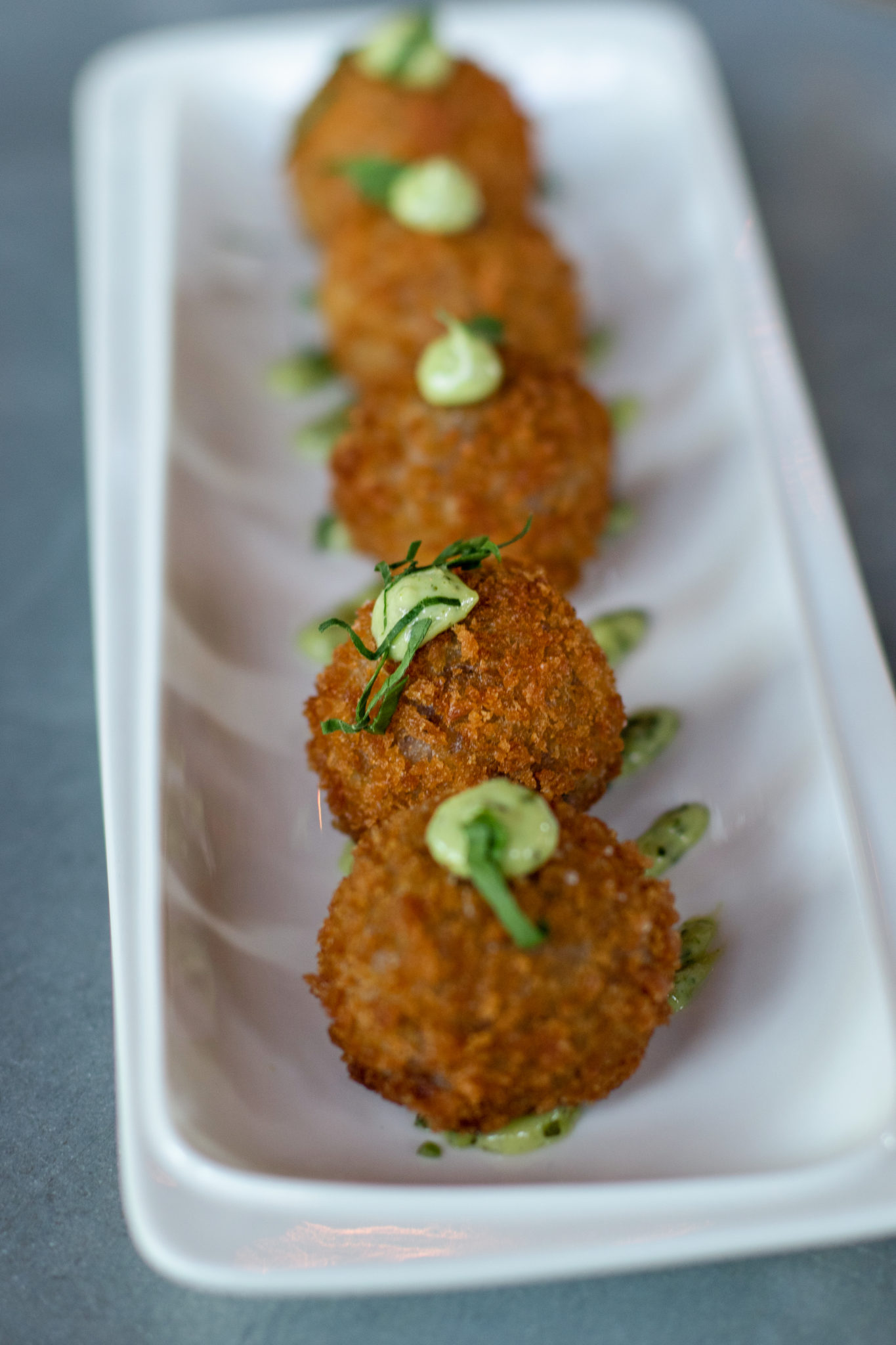 Red wine arancini at Coyote Sonoma in Healdsburg. (Heather Irwin / The Press Democrat)