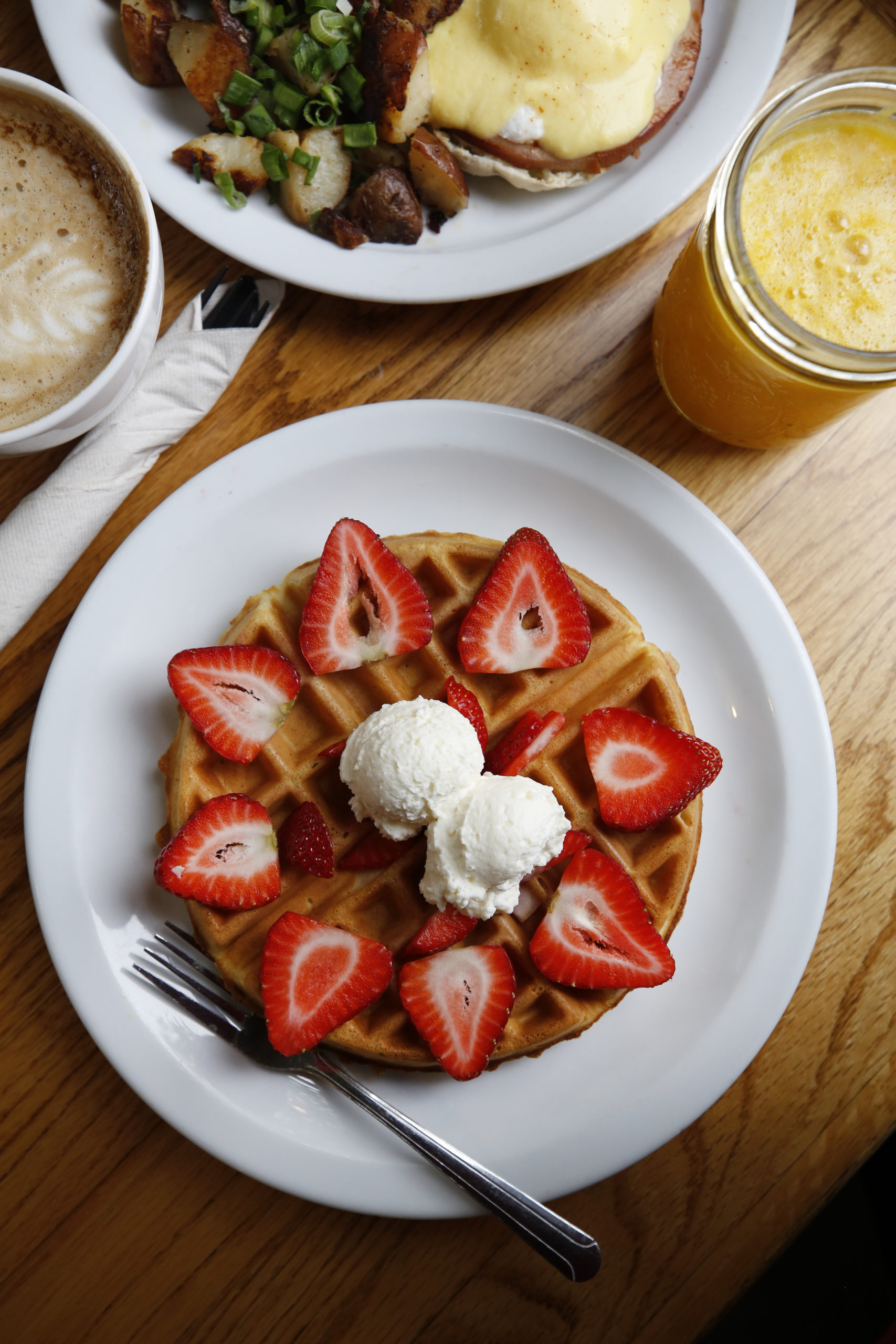 The Belgian waffle with strawberries and cream, the original Eggs Benedict, freshly squeezed orange juice and a cappuccino at the Howard Station Cafe in Occidental, Calif., on Thursday, May 13, 2021. (Beth Schlanker/Sonoma Magazine)