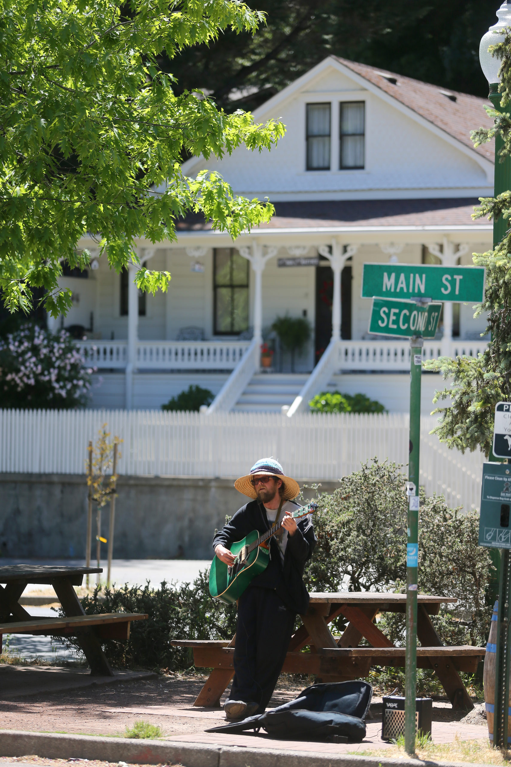 Aaron Jansen plays the guitar and sings outside the Howard Station Cafe in Occidental, Calif., on Thursday, May 13, 2021. (Beth Schlanker/Sonoma Magazine)